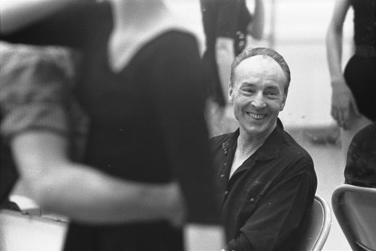 Balanchine, sitting smiling during a rehearsal at the NYC Ballet