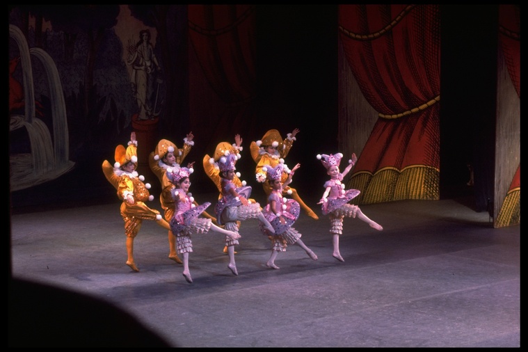 Young dancers in purple and yellow Harlequinade costumes